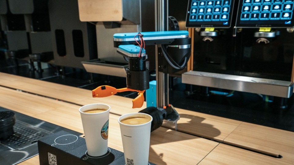 Arm docked in front of the espresso machines